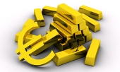 Koncept zlatých tehál spolu so zlatým symbolom eura